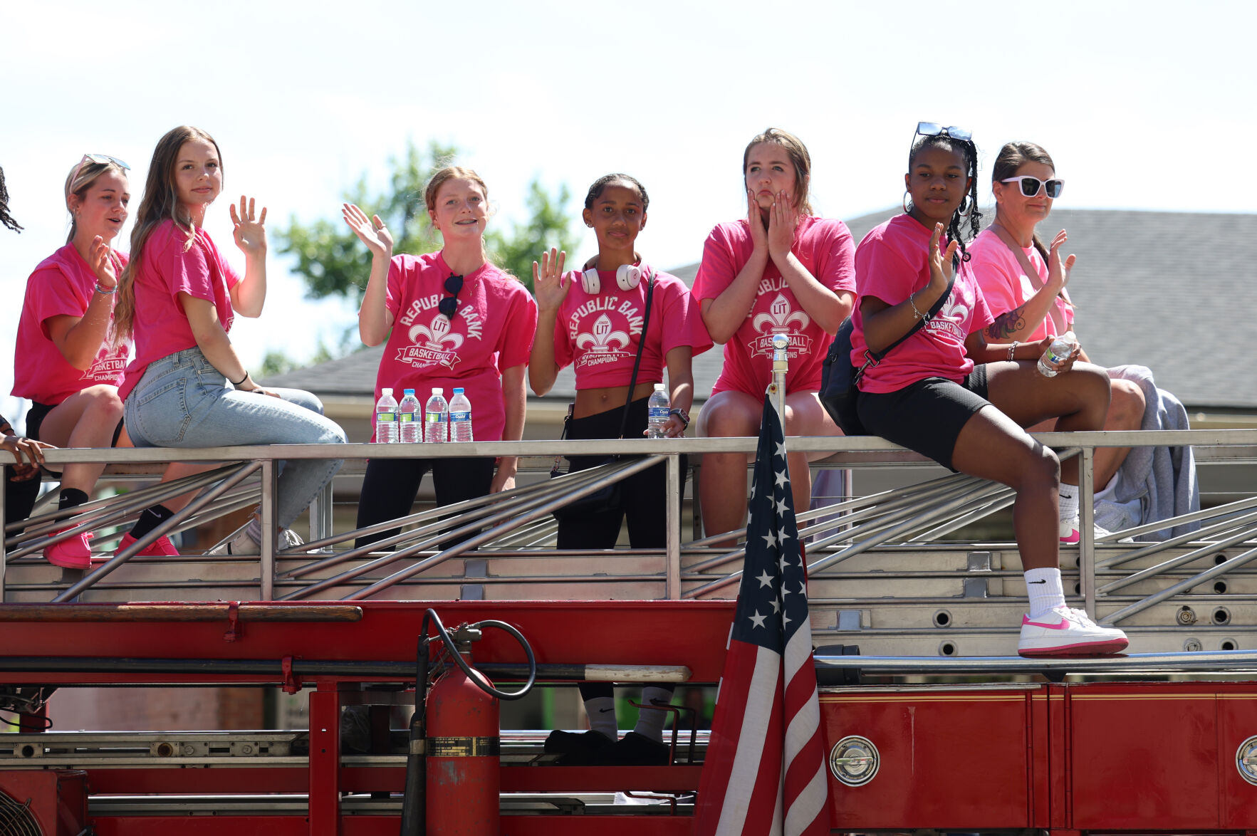 People ride a fire truck at Pegasus Parade.JPG